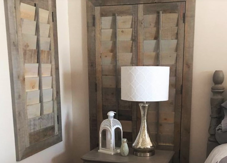 Las Vegas bedroom with reclaimed wood shutters.